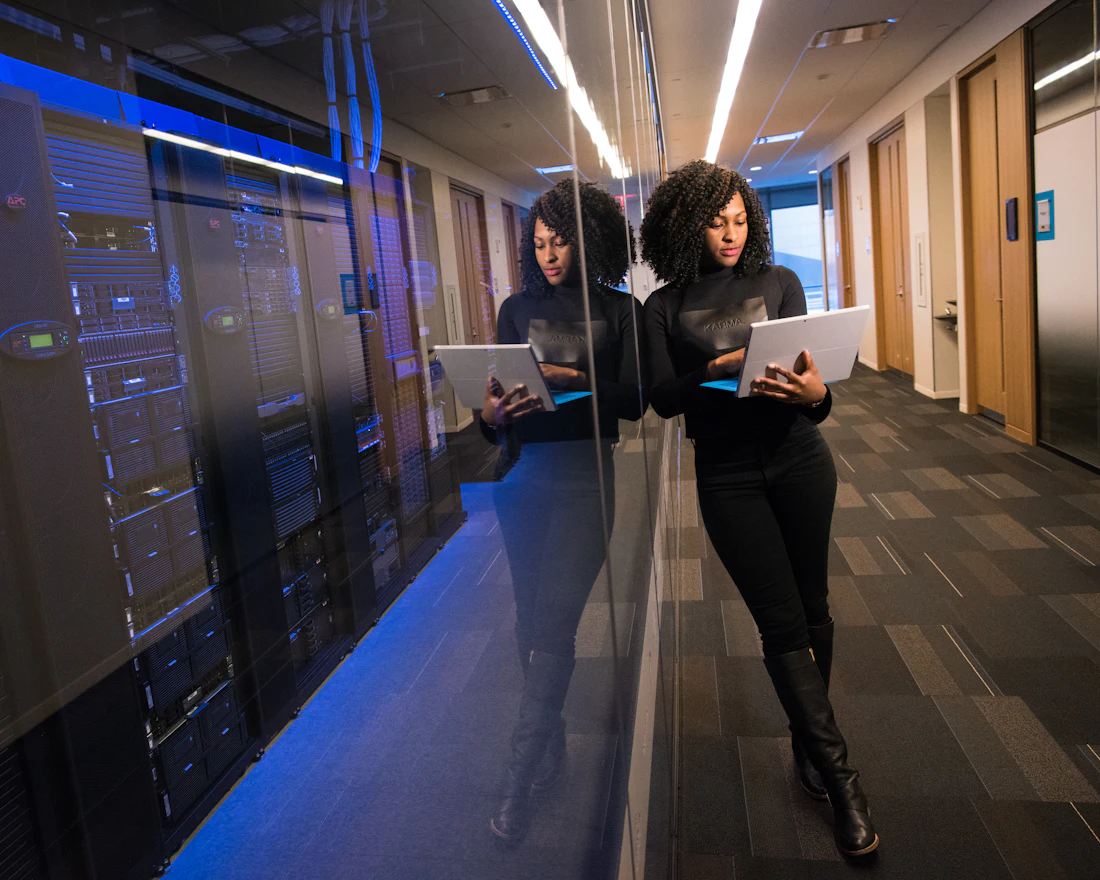 An engineer working in a data-center corridor